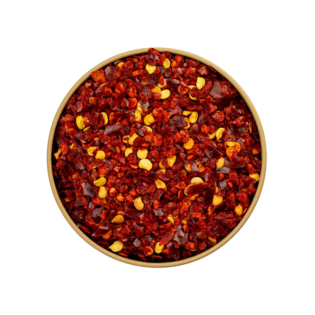 Bird Eye Chili Flocken – leuchtend rote, grob gemahlene Chilistücke mit sichtbaren Samen